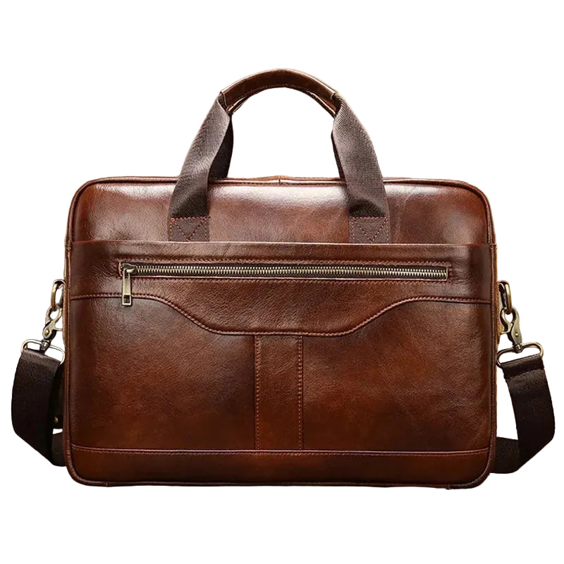 Brown leather briefcase with a shoulder strap on a wooden surface