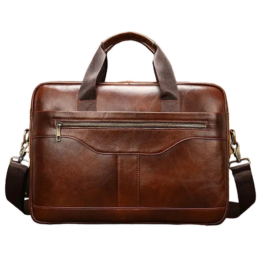 Brown leather briefcase with a shoulder strap on a wooden surface