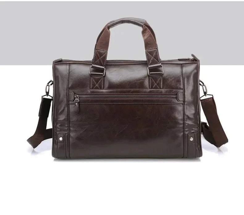 Brown leather briefcase with shoulder strap on a light gray background